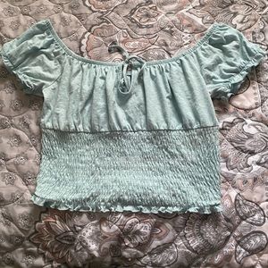 Light blue ruffled shirt